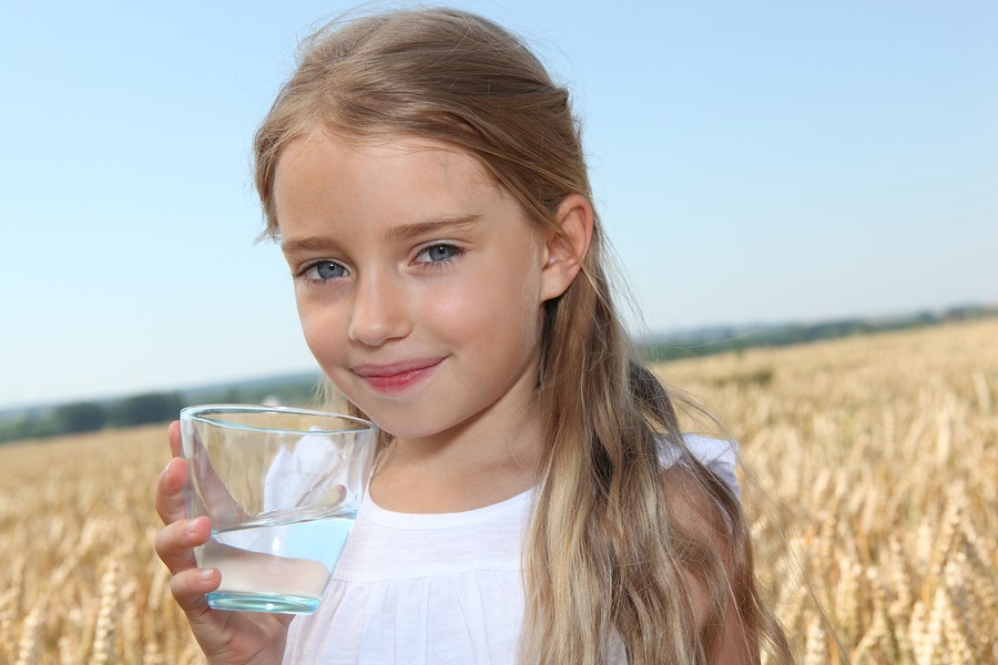 Young Girl Drinking Clean Water